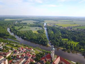 an aerial view of a town and a river at Krejčovství in Mělník