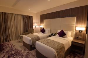 Postel nebo postele na pokoji v ubytování Paradise Elite Hotel Al-Tahlia Jeddah