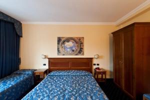 Postel nebo postele na pokoji v ubytování Albergo Costantini