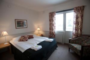 Postel nebo postele na pokoji v ubytování Insjöns Hotell + 24 fotografií
