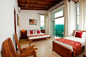 Giường trong phòng chung tại Hotel See Kandy