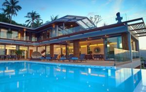 a house with a swimming pool in front of it at 9 Bedroom Sea Blue View Villa - 5 Star with Staff SDV080A-By Samui Dream Villas in Bophut