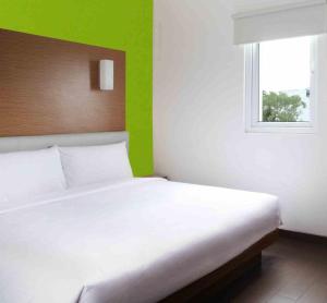 Ein Bett oder Betten in einem Zimmer der Unterkunft Amaris Hotel Pratama Nusa Dua