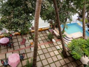 an overhead view of a resort with a pool and trees at Serene Waters Homestay Goa in Panaji