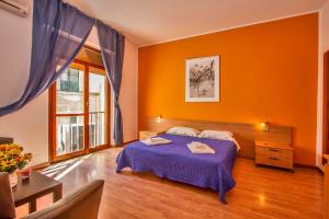 Ένα ή περισσότερα κρεβάτια σε δωμάτιο στο Mamma Sisi