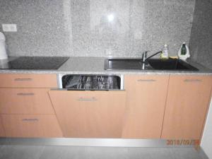 a kitchen with a sink and a counter top at Le Domaine De Marie in Palasca
