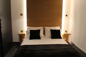 Cama o camas de una habitación en Salamanca Suites Libertad