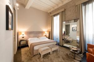 Postel nebo postele na pokoji v ubytování DOM Hotel Roma - Preferred Hotels & Resorts + 37 fotografií