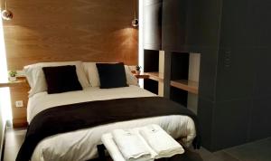 Cama o camas de una habitación en Salamanca Suites Libertad