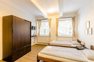 Posteľ alebo postele v izbe v ubytovaní Žižkov Cosy Studio Apartments