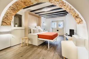 Un pat sau paturi într-o cameră la Guest Inn Alfama