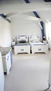 Postel nebo postele na pokoji v ubytování La Douce France Trianon