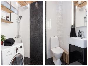 uma casa de banho com uma máquina de lavar roupa e um lavatório em Central Alexandra em Tampere