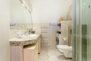 a bathroom with a toilet and a sink and a shower at Rent like home - Krzeptówki in Zakopane