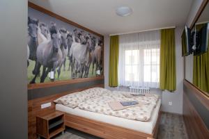 Postel nebo postele na pokoji v ubytování Hotel U koně