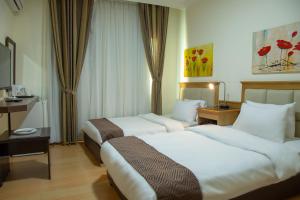 En eller flere senger på et rom på 360 Hotel By FHM