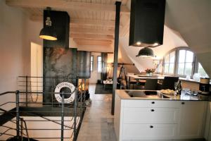 a kitchen with a sink and a counter top at "Kontorhaus" by Ferienhaus Strandgut in Born