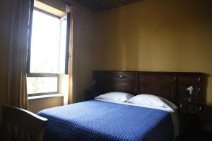 A bed or beds in a room at Hotel Damian Park Hotel Delle Magnolie