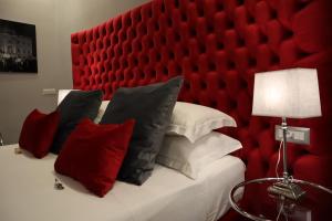 Postel nebo postele na pokoji v ubytování MILLINA SUITES IN NAVONA