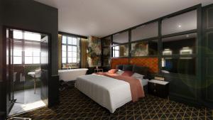 a bedroom with a large bed and a bath tub at The Bedford Balham - Live Music Venue in London