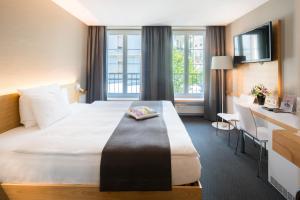 Giường trong phòng chung tại Best Western Plus Hotel Zürcherhof