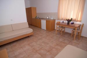 A kitchen or kitchenette at Lambis Studios & Apartments