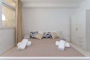 Posteľ alebo postele v izbe v ubytovaní Ratak House