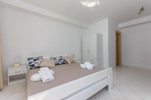 Posteľ alebo postele v izbe v ubytovaní Ratak House