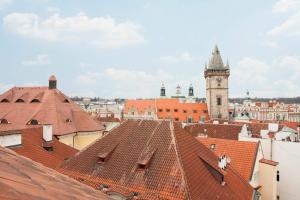 a large building with a clock on top of it at Kozna Loft in Prague
