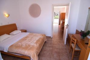 A bed or beds in a room at Lambis Studios & Apartments