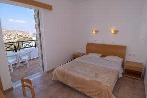 A bed or beds in a room at Lambis Studios & Apartments