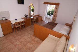 A bed or beds in a room at Lambis Studios & Apartments