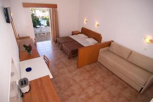 A bed or beds in a room at Lambis Studios & Apartments