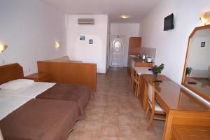 A bed or beds in a room at Lambis Studios & Apartments