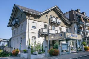 a building with a sign for a hotel at Hotel Ritter Badenweiler in Badenweiler