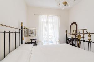 Postel nebo postele na pokoji v ubytování Merkanti Apartments