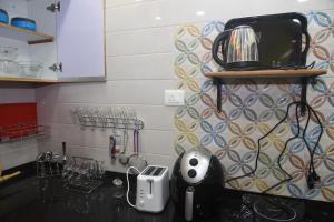 Una cocina o cocineta en Square Suite