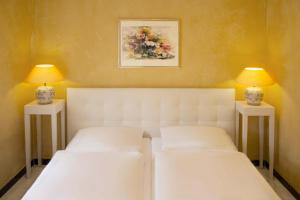 Säng eller sängar i ett rum på Hotel Stadtresidenz