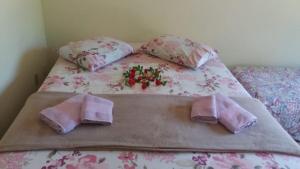 Cama ou camas em um quarto em Sítio Flora Rei