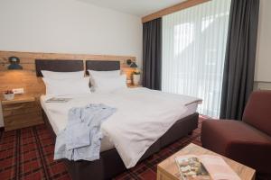 Postel nebo postele na pokoji v ubytování Hotel Kammerer