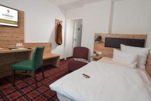 Postel nebo postele na pokoji v ubytování Hotel Kammerer