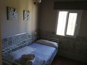 Postel nebo postele na pokoji v ubytování VillaConil