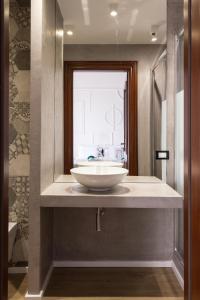 a bathroom with a white sink and a window at Panoramica dei Templi B&B in Agrigento