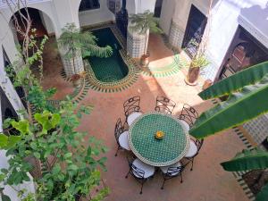 an overhead view of a patio with a table and chairs at Riad Al Mamoune in Marrakesh
