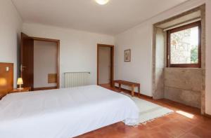 Postel nebo postele na pokoji v ubytování Casa de Sapiao & Studio