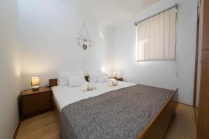 Postel nebo postele na pokoji v ubytování Apartman Ruzica Crikvenica