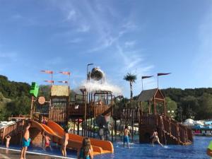 a group of people in the water at a water park at Počitniška hišica Petra in Podčetrtek