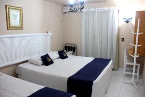 Cama ou camas em um quarto em Hotel Solar do Imperador