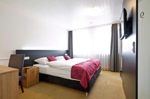Tempat tidur dalam kamar di Landgasthof Lamm