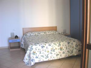 Postel nebo postele na pokoji v ubytování Acciaroli Vacanze Residence
